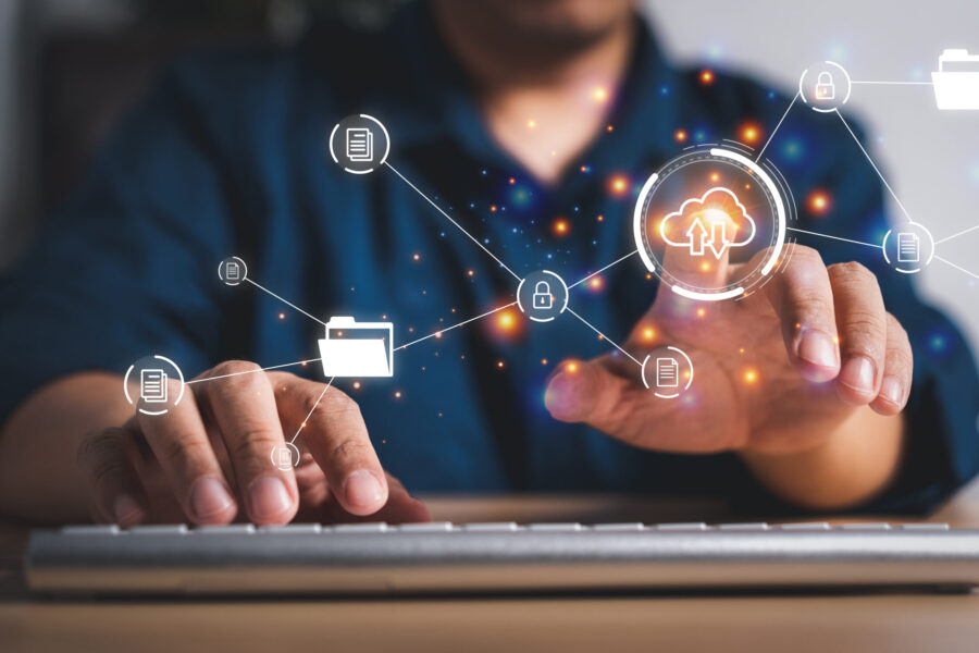 Businessman working on virtual screen of Document Management System (DMS). Software for archiving, searching, and managing corporate files and information, documentation in enterprise with ERP.