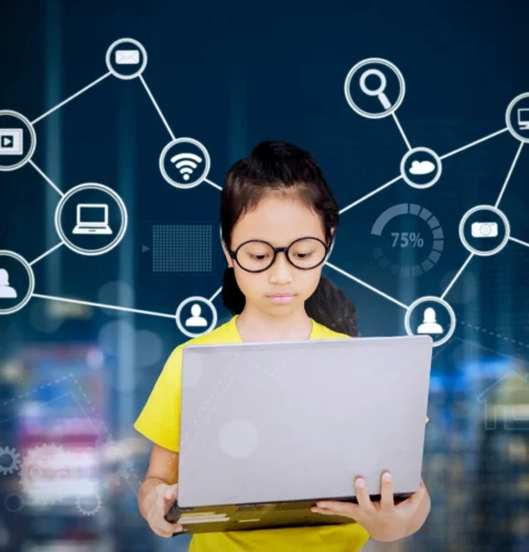 digital-composite-image-serious-girl-using-laptop-with-icons