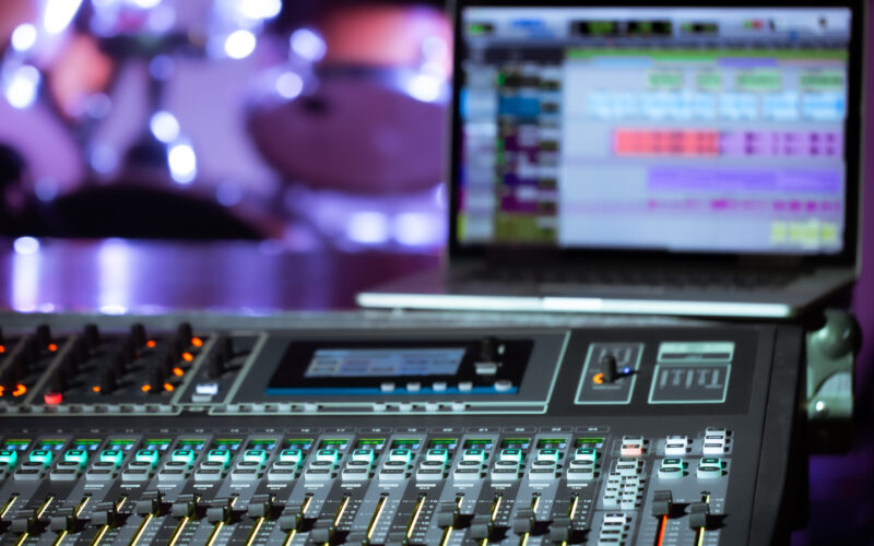 Digital mixer in a recording Studio , with a computer for recording music. The concept of creativity and show business. Space for text.