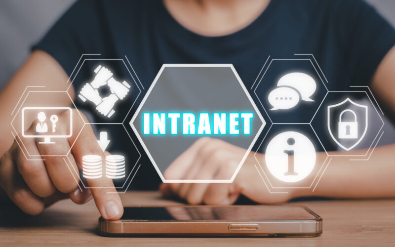 Intranet concept, Person touching on smart phone with intranet icon on virtual screen.